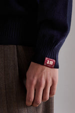 Polo in cashmere con bottoni